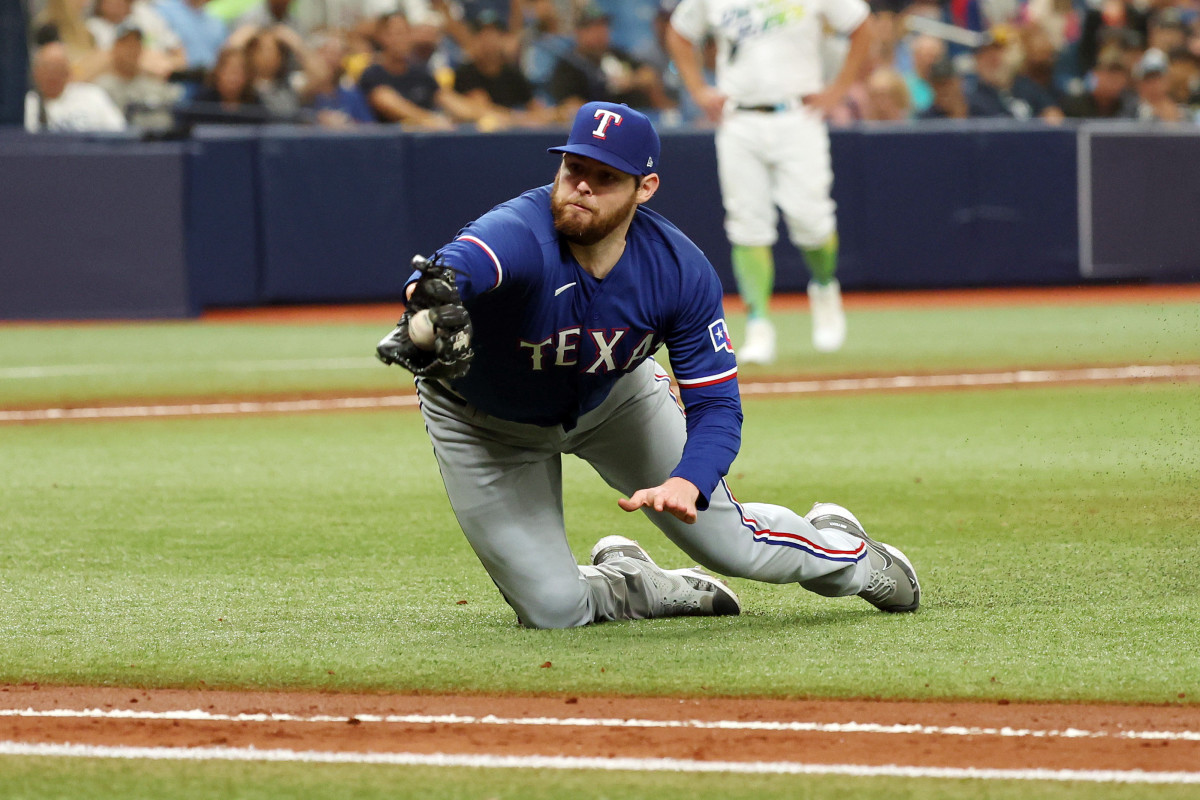 Texas Rangers starting pitcher Jordan Montgomery makes a diving catch against the Tampa Bay Rays in the second inning during Game 1 of the Wild Card series at Tropicana Field Tuesday.