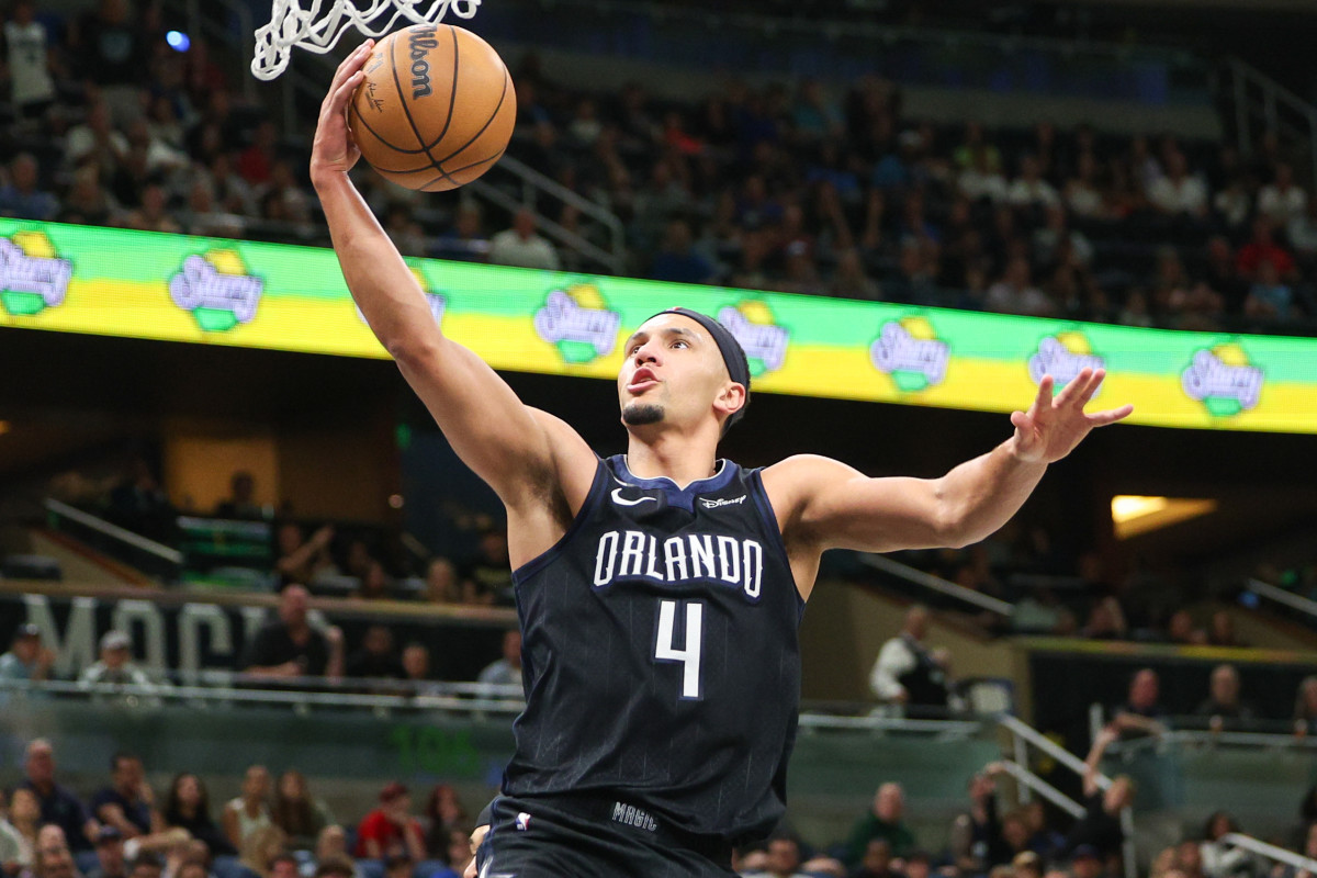 Orlando Magic guard Jalen Suggs (4) drives to the hoop against the Utah Jazz in the second quarter at Amway Center.