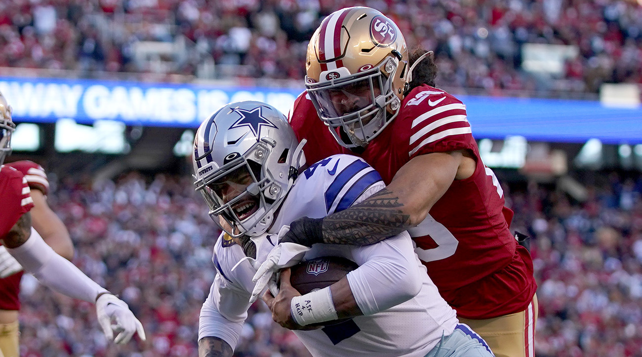 Cowboys quarterback Dak Prescott tackled by 49ers safety Talanoa Hufanga in a 2022 playoff loss.