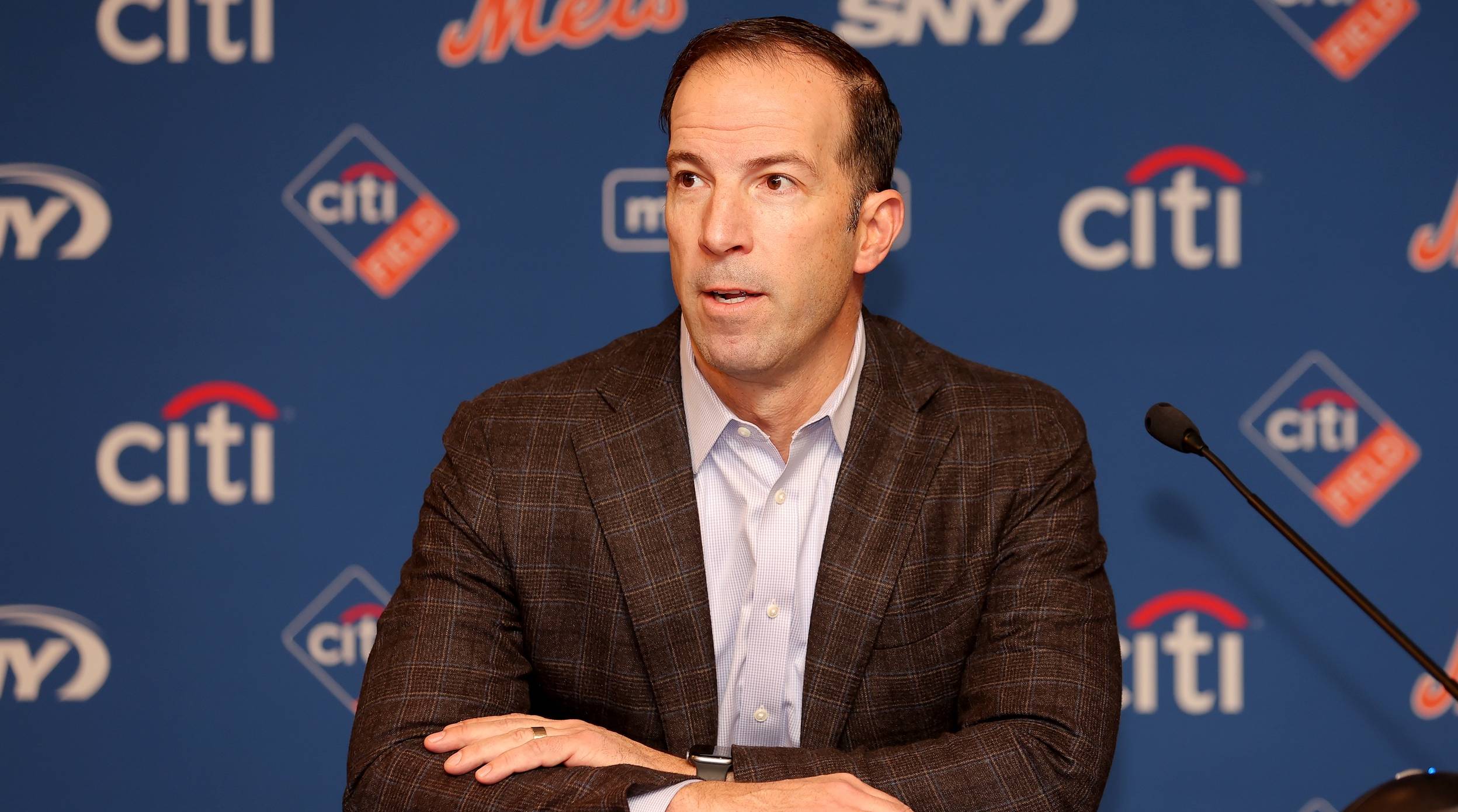 Mets general manager speaks with the media at a press conference.