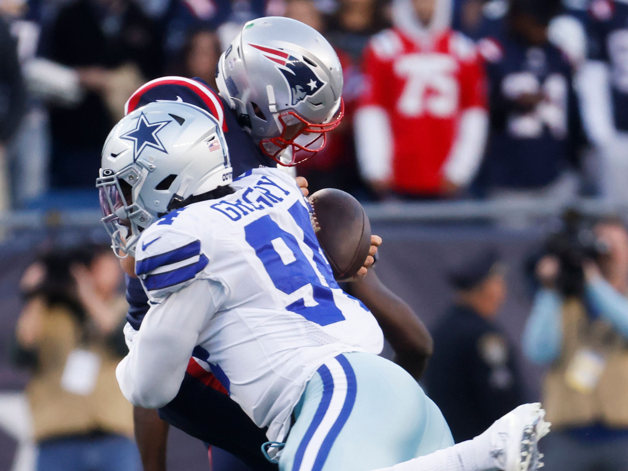 Randy Gregory recording a sack against the Patriots in 2021.