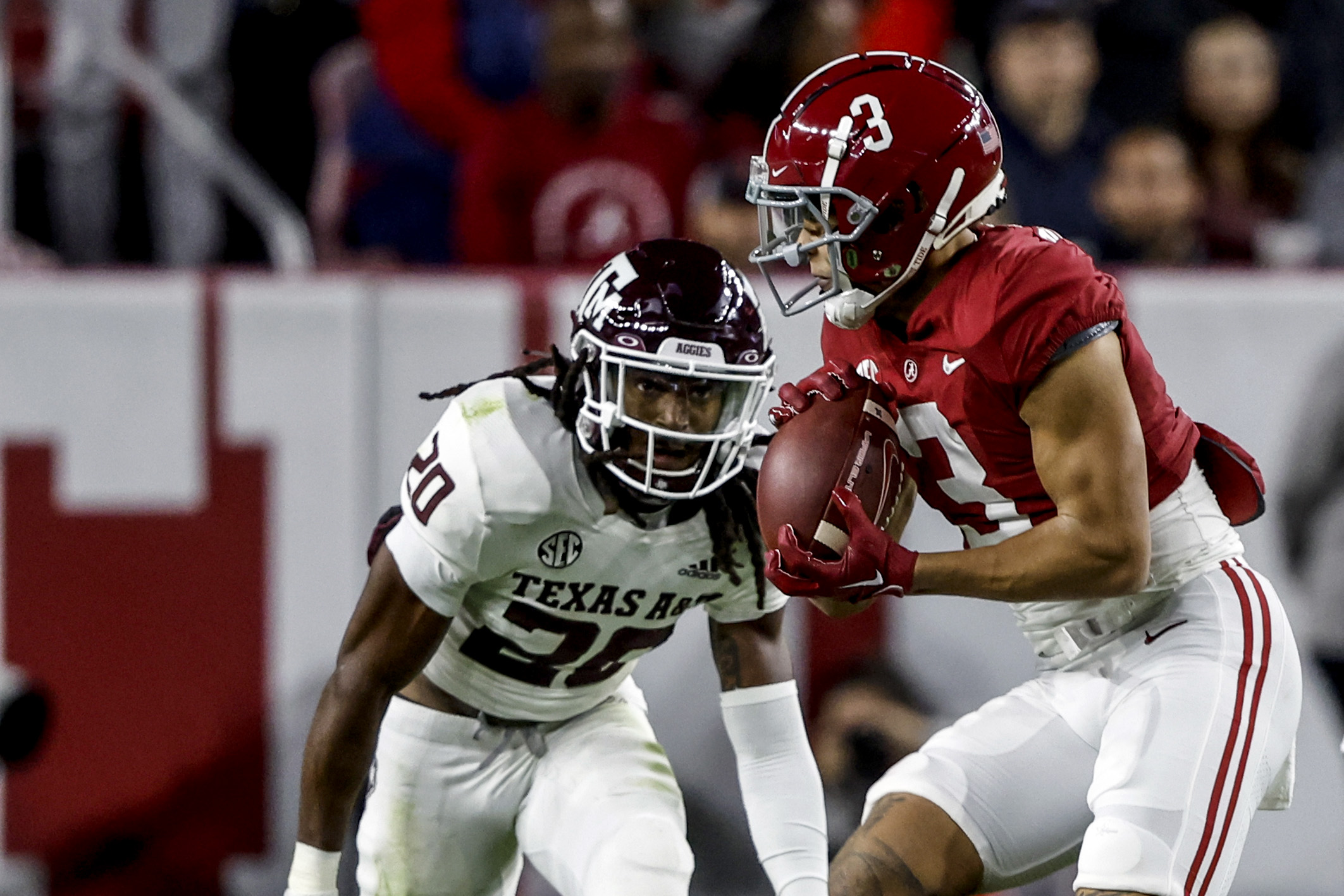 Texas A&M Aggies defensive back Jardin Gilbert (20) chases down Alabama Crimson Tide wide receiver Jermaine Burton (3) during their game at Bryant-Denny Stadium Oct. 8, 2022.