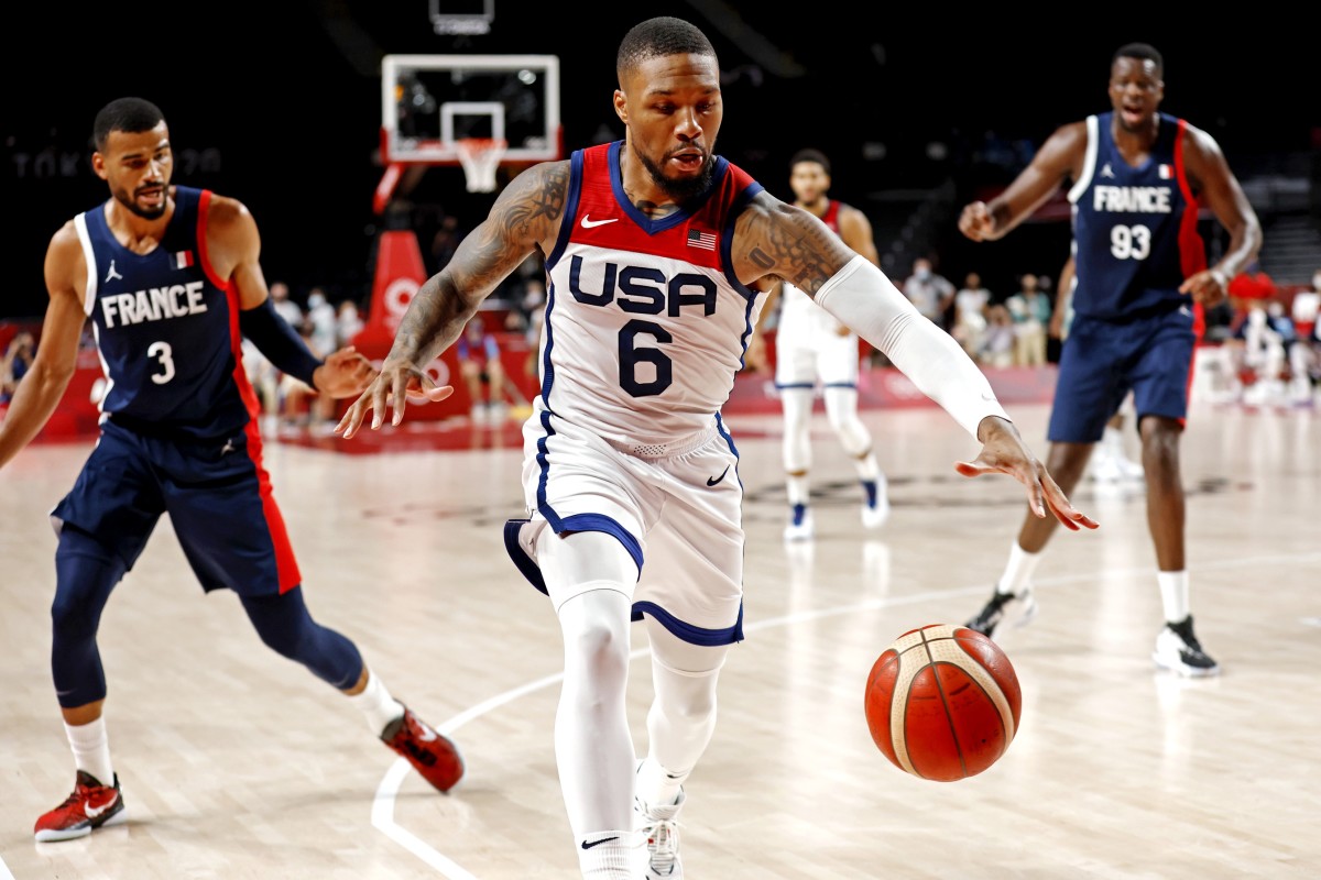 United States guard Damian Lillard (6) save a ball from going out of bounds against France 
