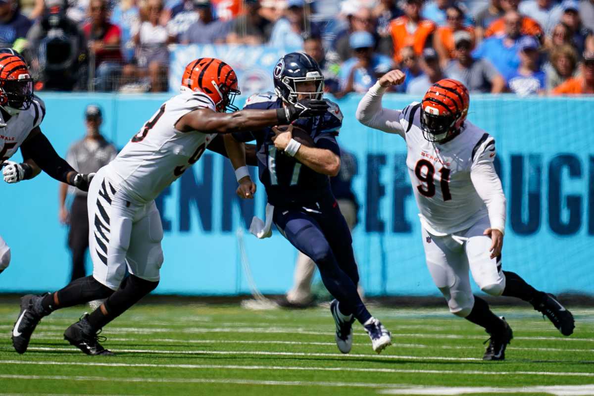 Tennessee Titans quarterback Ryan Tannehill (17) is sacked by Cincinnati Bengals defensive end Myles Murphy (99) and defensive end Trey Hendrickson (91) during the second quarter at Nissan Stadium in Nashville, Tenn., Sunday, Oct. 1, 2023.  