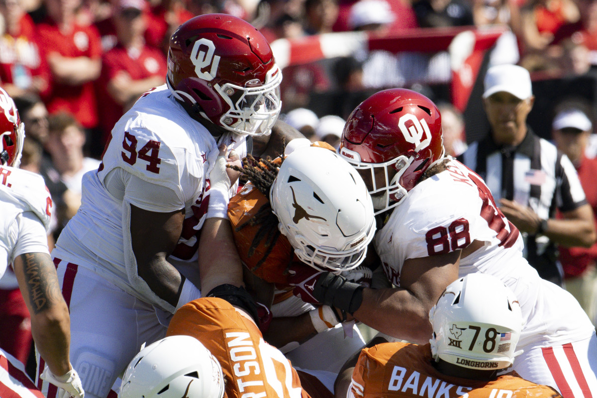 Texas Longhorns running back Jonathon Brooks gets tackled against the Oklahoma Sooners Saturday at the Cotton Bowl.