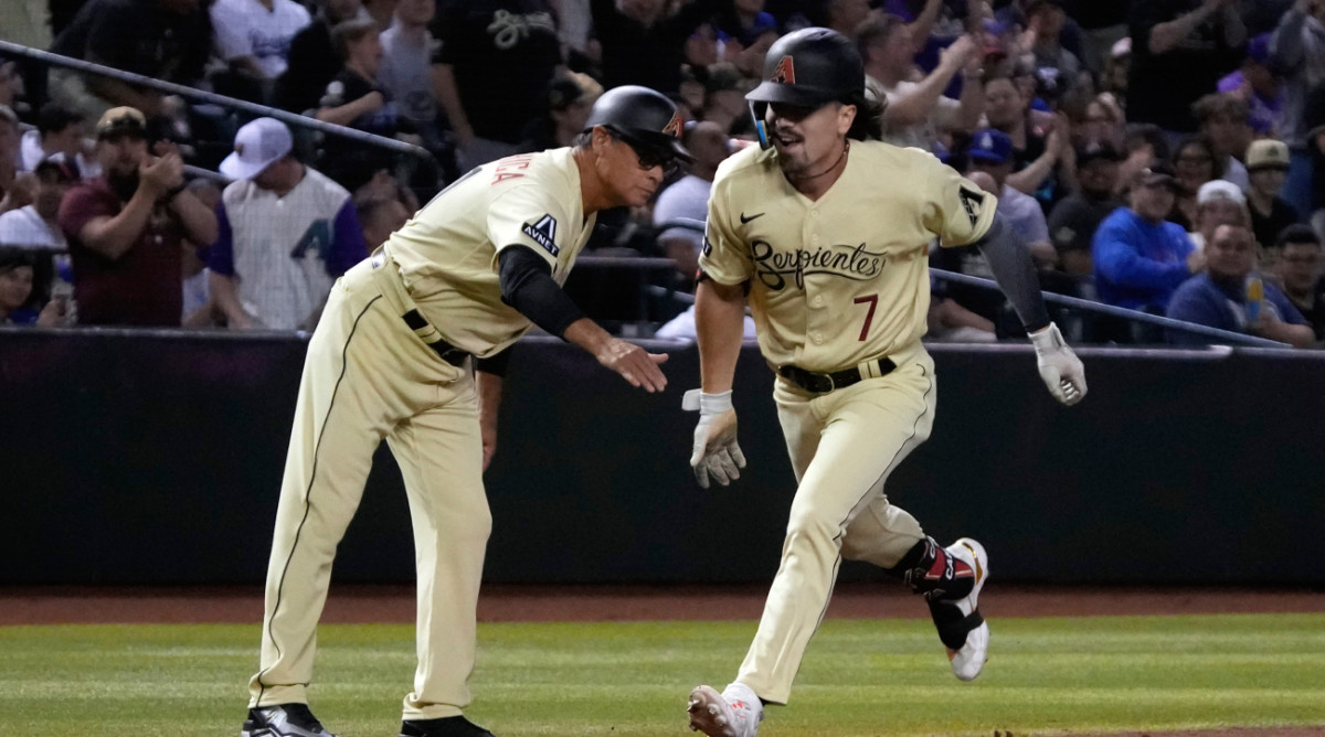 Corbin Carroll rounds home for the Diamondbacks against the Dodgers after hitting a home run.