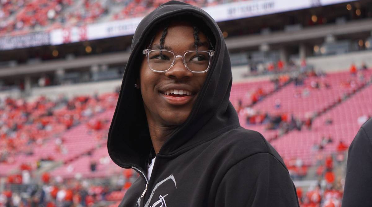 High school basketball recruit Bryce James smiles while attending an Ohio State football game.