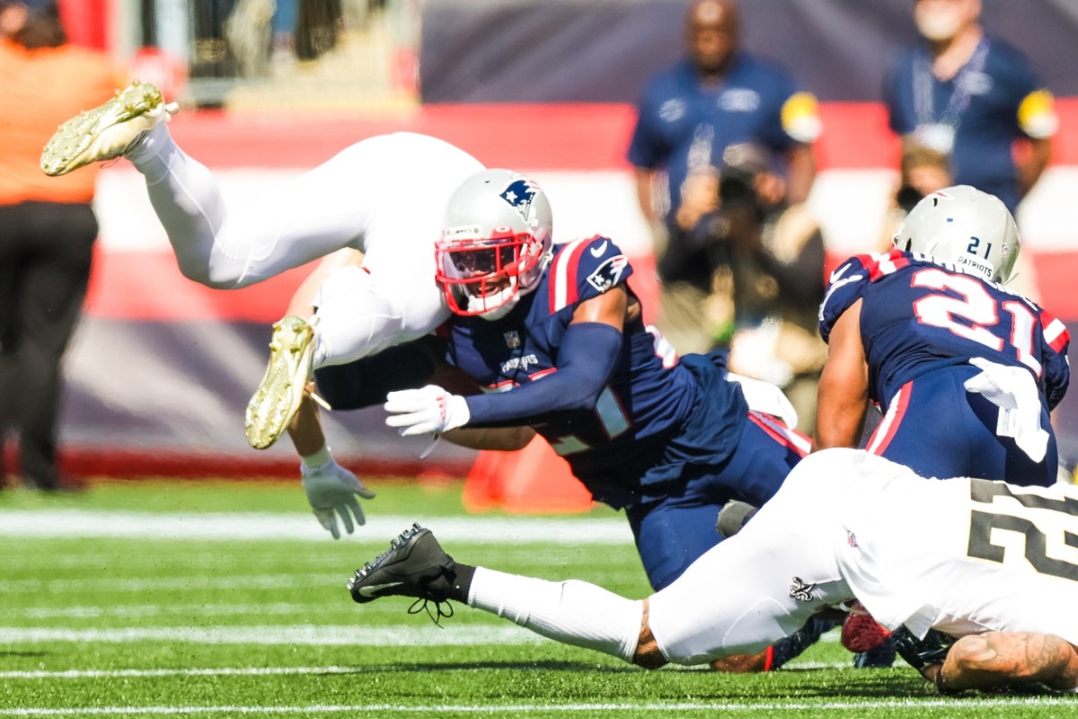 Sep 26, 2021; New England Patriots cornerback J.C. Jackson (27) tackles Taysom Hill (7) of the New Orleans Saints. Mandatory Credit: Stephen Lew-USA TODAY Sports