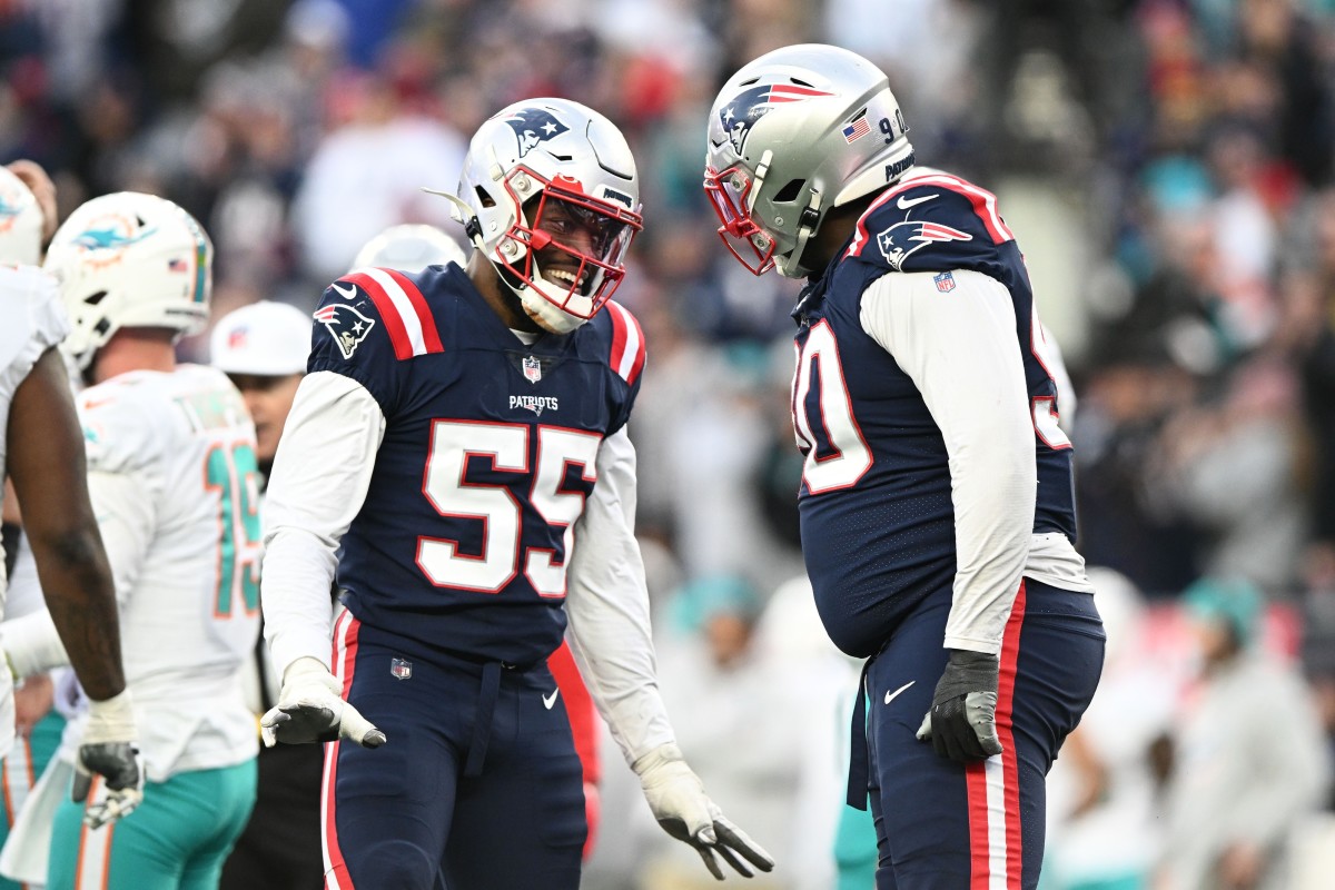 Jan 1, 2023; New England Patriots linebacker Josh Uche (55) reacts with defensive tackle Christian Barmore (90) after a sack against the Miami Dolphins. Mandatory Credit: Brian Fluharty-USA TODAY Sports