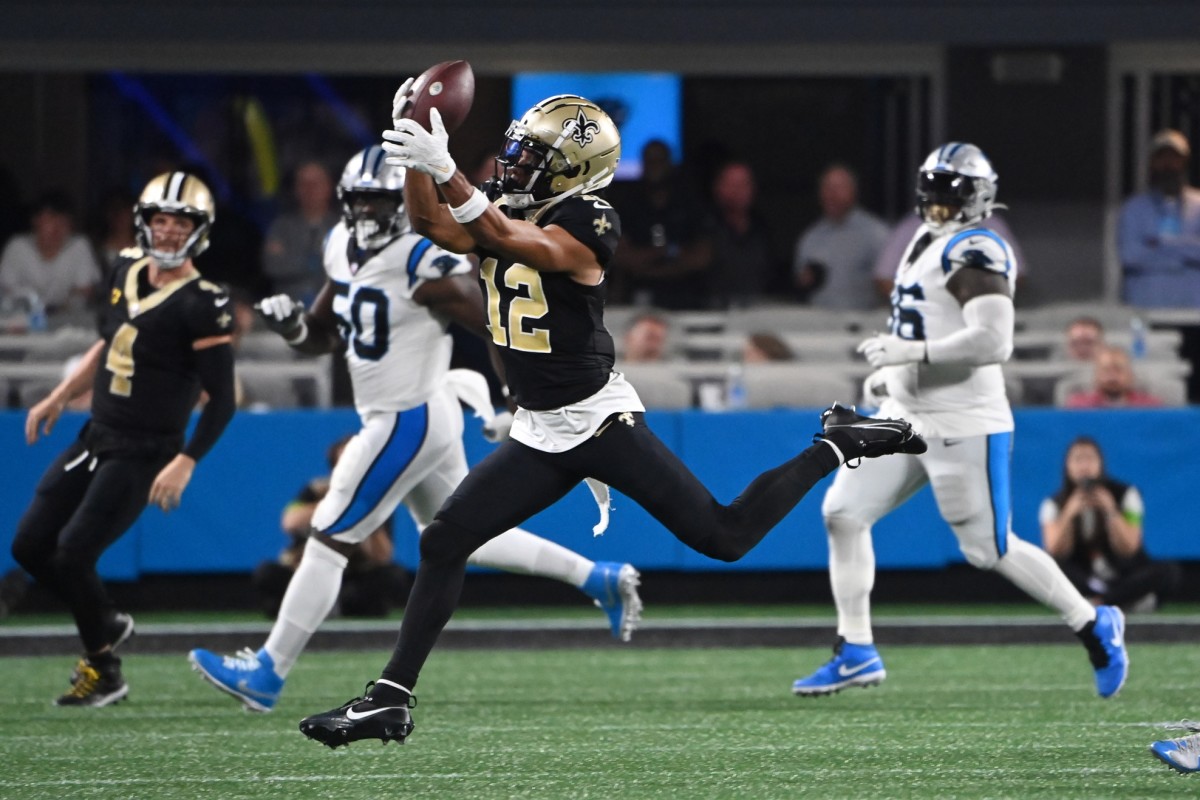 Sep 18, 2023; New Orleans Saints receiver Chris Olave (12) catches the ball against the Carolina Panthers. Mandatory Credit: Bob Donnan-USA TODAY Sports