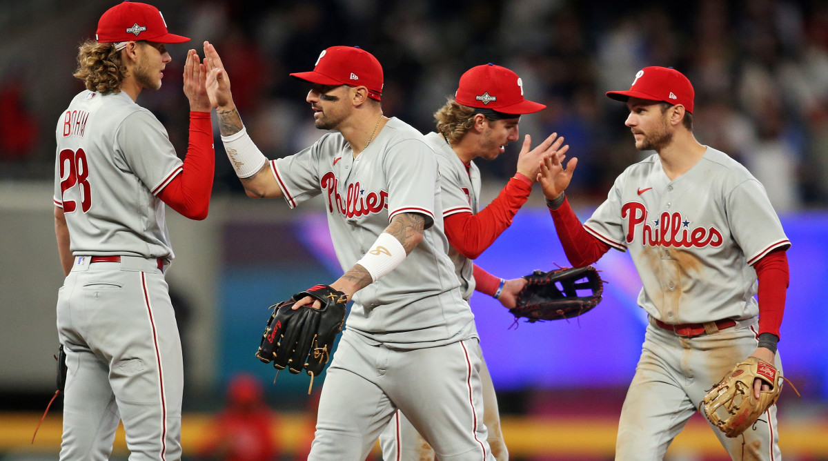 The Phillies celebrate a Game 1 win over the Braves