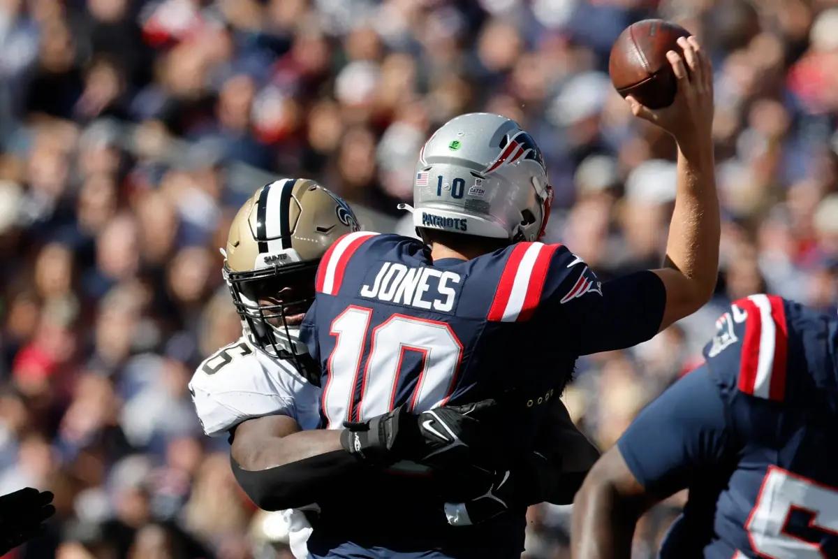 Jones is sacked during Sunday's game against the Saints.