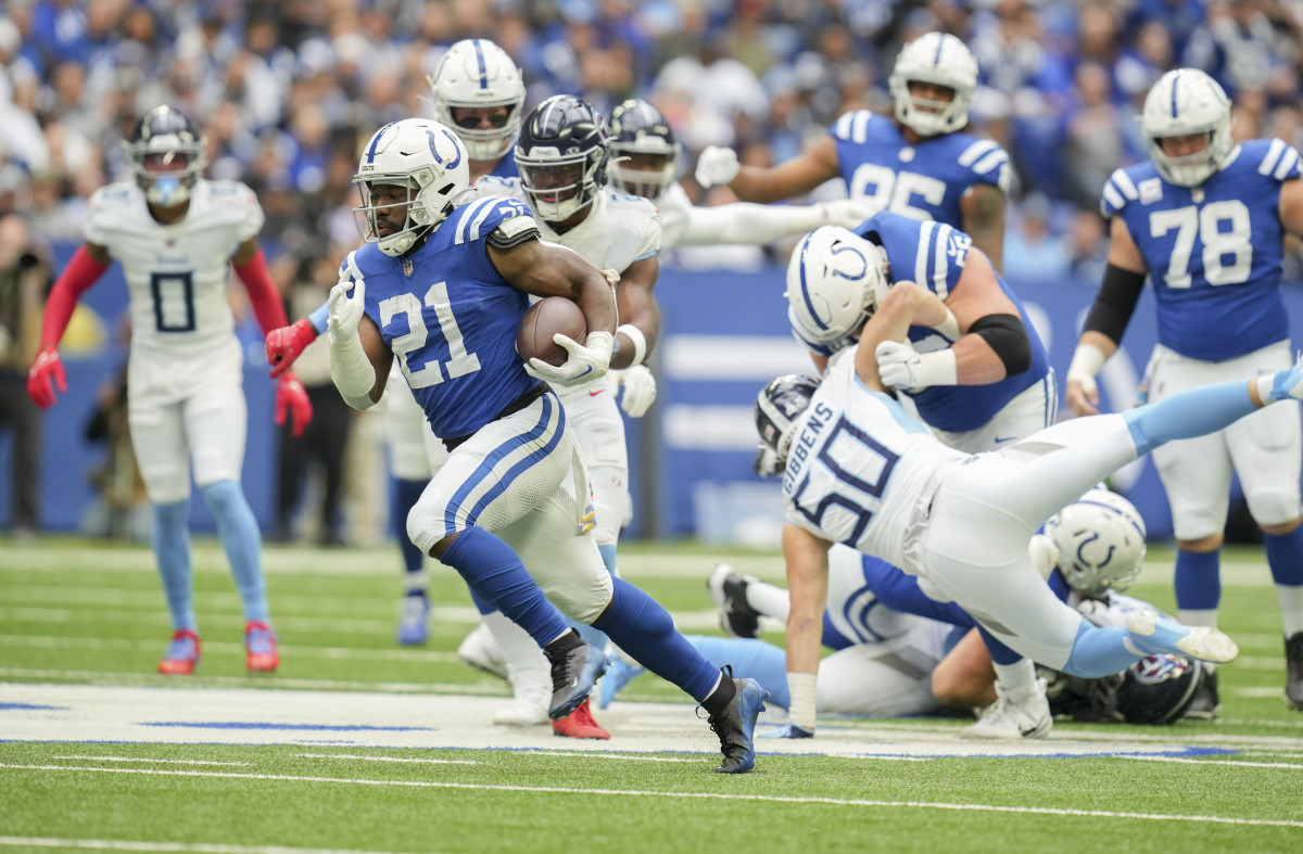 Oct 8, 2023; Indianapolis, Indiana, USA; Indianapolis Colts running back Zack Moss (21) rushes the ball for a touchdown during a game against the Tennessee Titans at Lucas Oil Stadium.