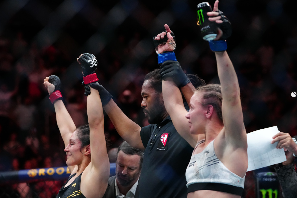 Sep 16, 2023; Las Vegas, Nevada, USA; Alexa Grasso (red gloves) and Valentina Shevchenko (blue gloves) react after the fight during UFC Fight Night at T-Mobile Arena. Mandatory Credit: Stephen R. Sylvanie-USA TODAY Sports
