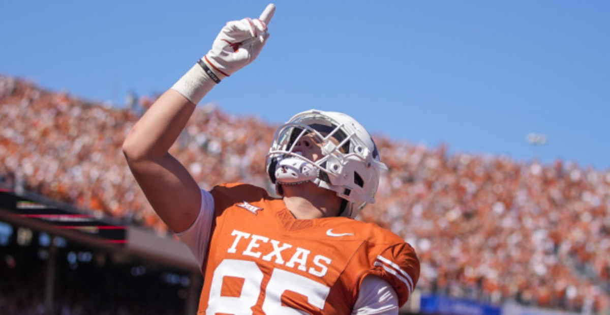 Texas Longhorns tight end Gunnar Helm celebrates after scoring a touchdown during a college football game.