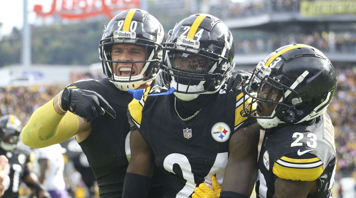 Steelers linebacker T.J. Watt and safety Damontae Kazee congratulate cornerback Joey Porter Jr. after an interception against the Ravens.