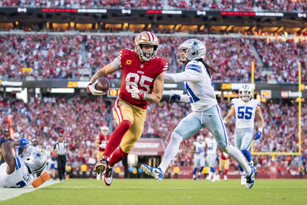 Cowboys cornerback Stephon Gilmore attempts to stop 49ers tight end George Kittle.