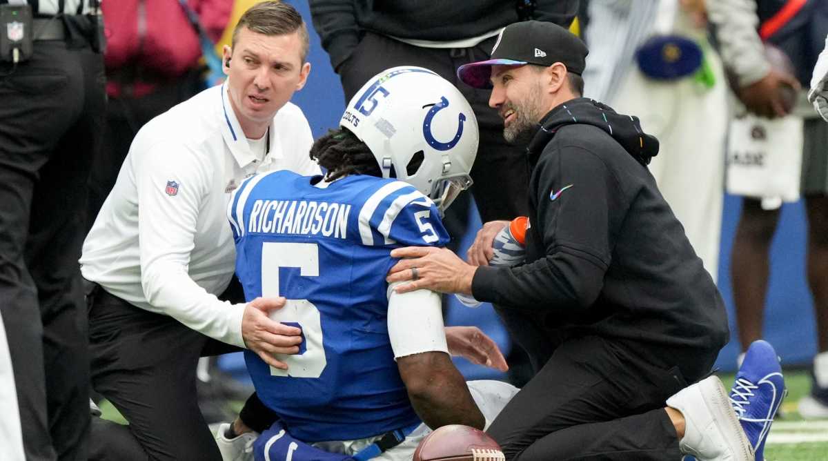 Colts quarterback Anthony Richardson sits on the ground after hurting his shoulder