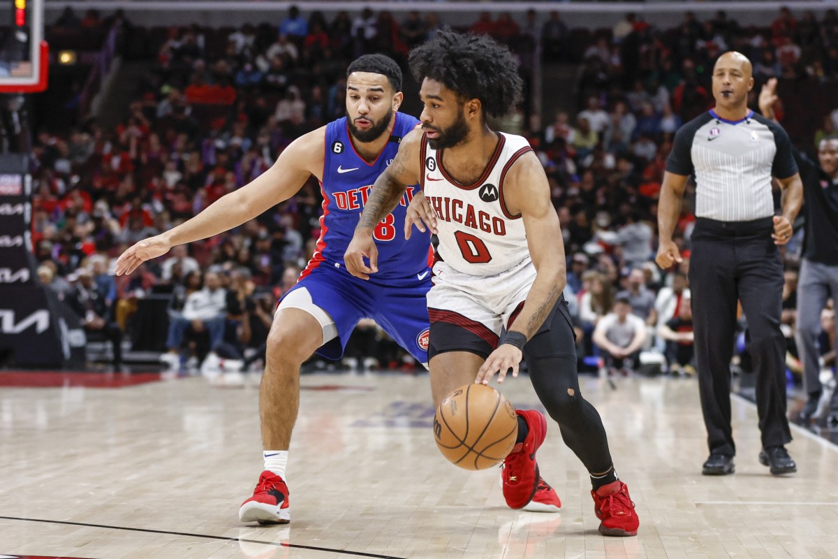 Chicago Bulls guard Coby White (0) drives to the basket against Detroit Pistons guard Cory Joseph (18)