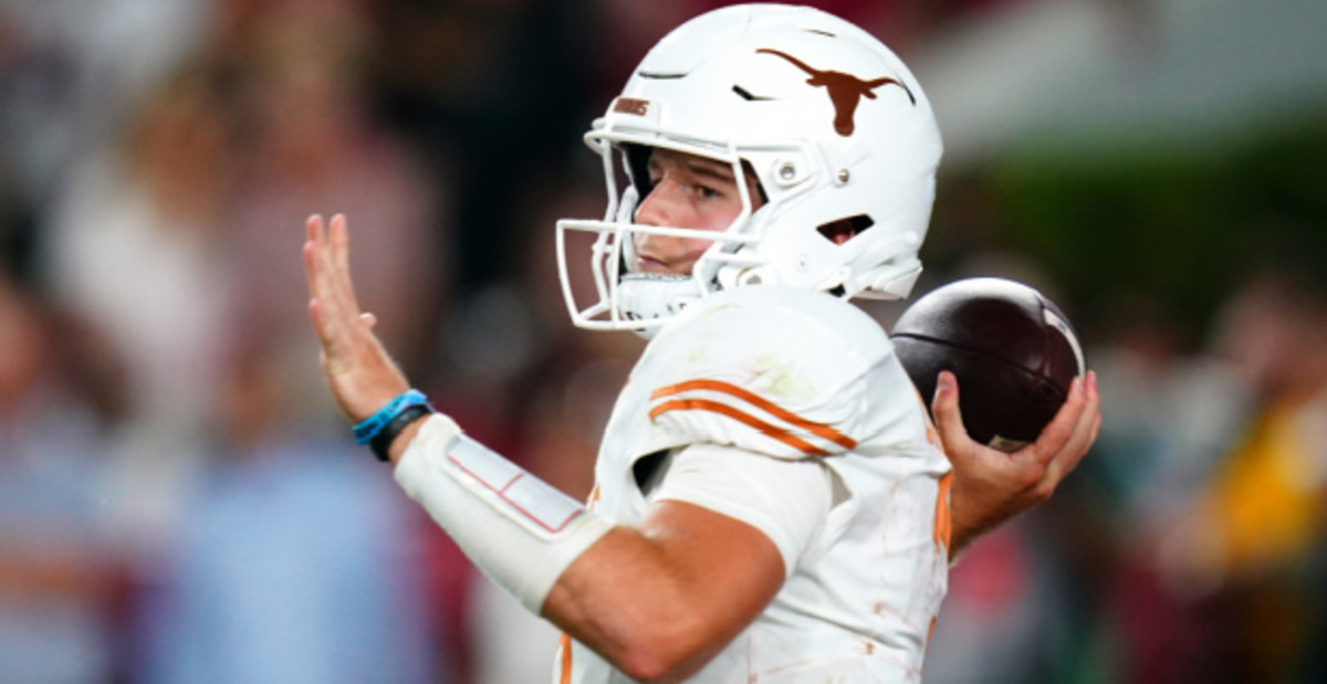 Texas Longhorns quarterback Quinn Ewers on a pass attempt during a college football game.