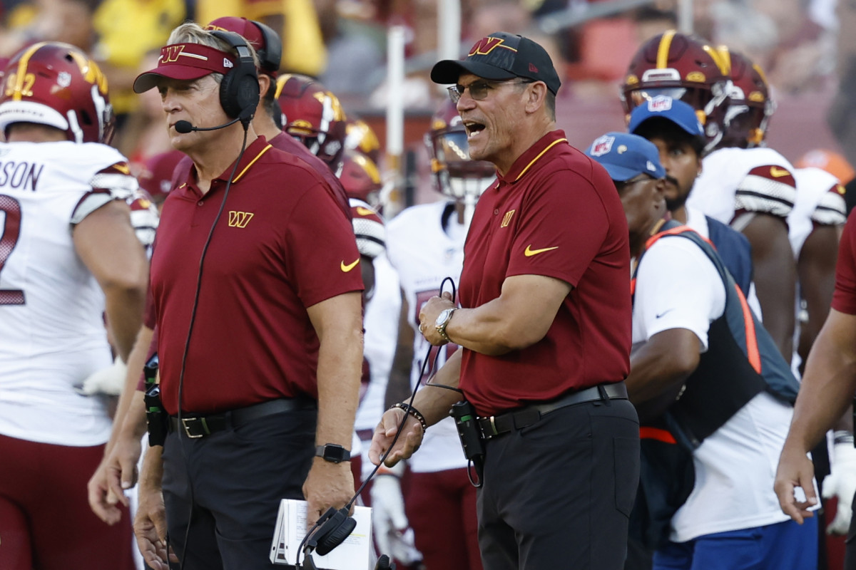 Washington Commanders defensive coordinator Jack Del Rio and Commanders head coach Ron Rivera stand on the sidelines against the Cincinnati Bengals during the second quarterat FedExField.