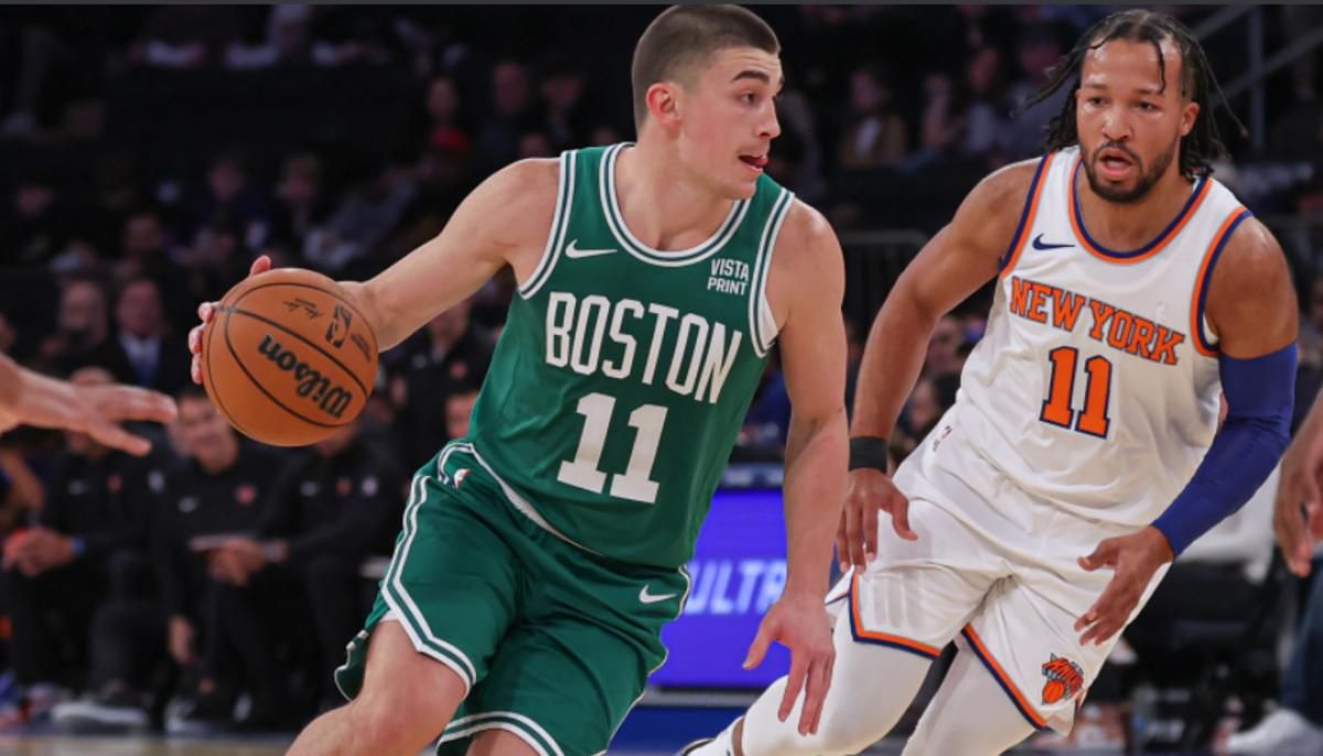 Jalen Brunson (R) guards Boston's Payton Pritchard in Monday's preseason victory