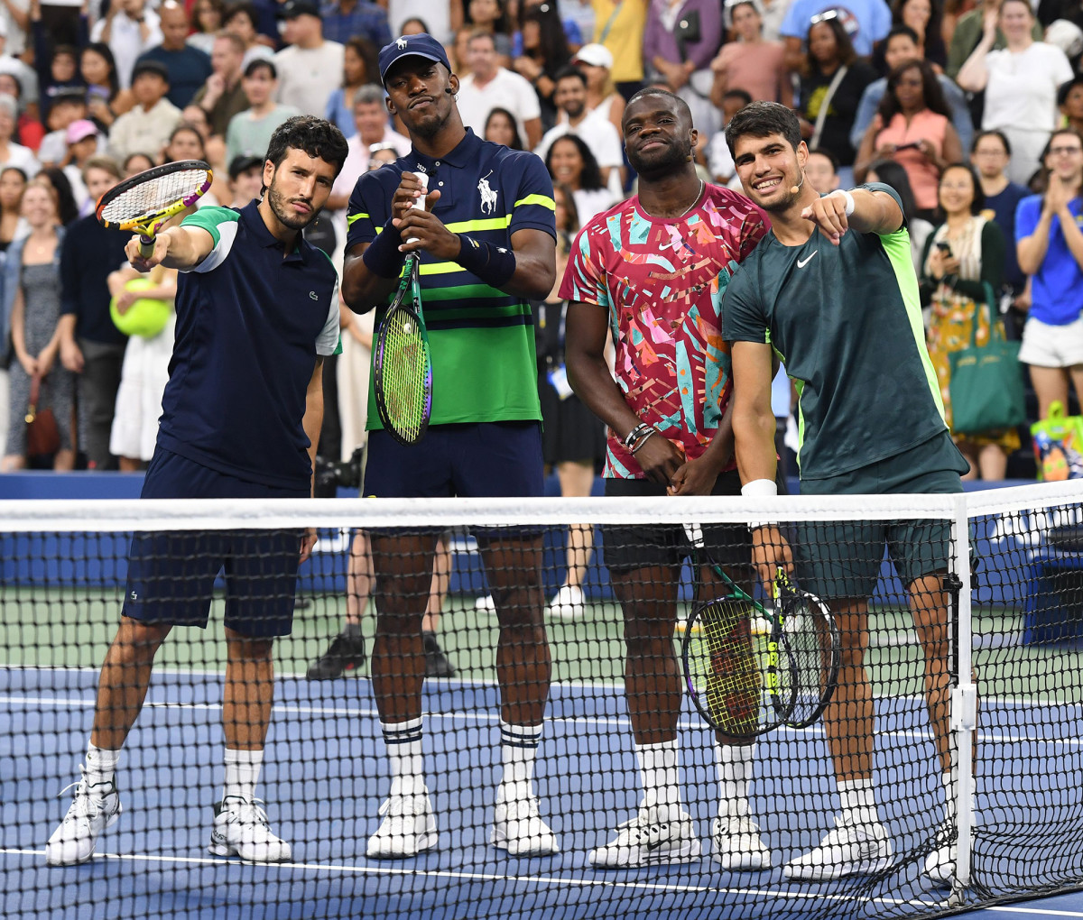Jimmy Butler poses for a photo with Sebastián Yatra, Frances Tiafoe and Carlos Alcaraz at the U.S. Open.