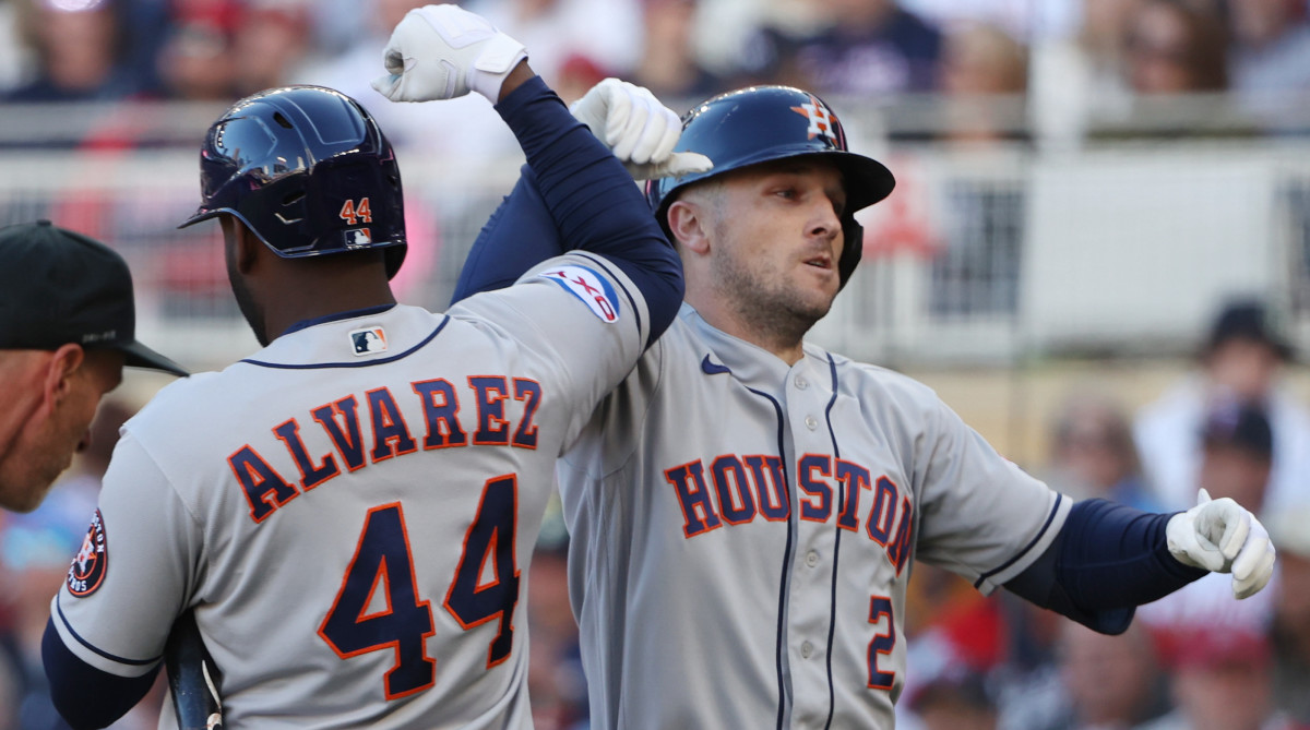 Astros third baseman Alex Bregman, right, celebrates a home run with Yordan Alvarez, left, in the fifth inning against the Minnesota Twins during game 3 of the 2023 ALDS