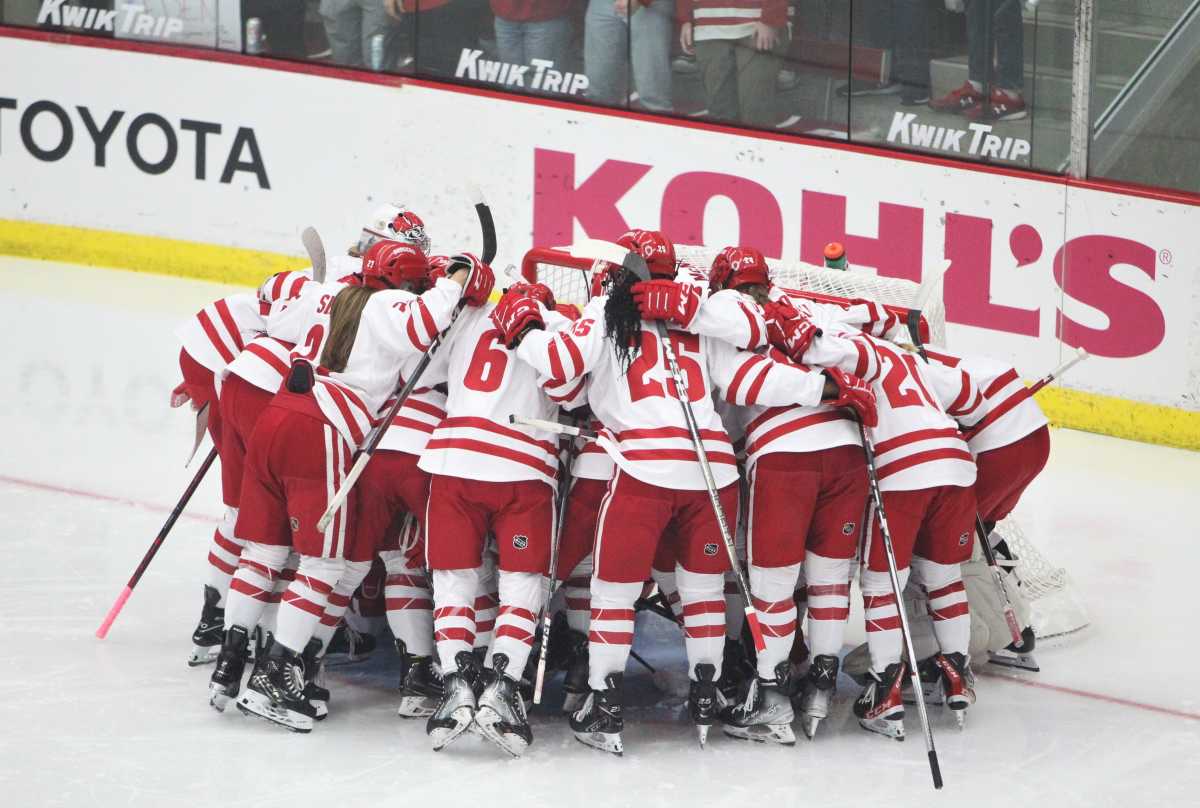 The Wisconsin women's hockey team gathers in front of its goal before the start of its game with Boston College on Friday Oct. 6, 2023 at LaBahn Arena in Madison, Wis.