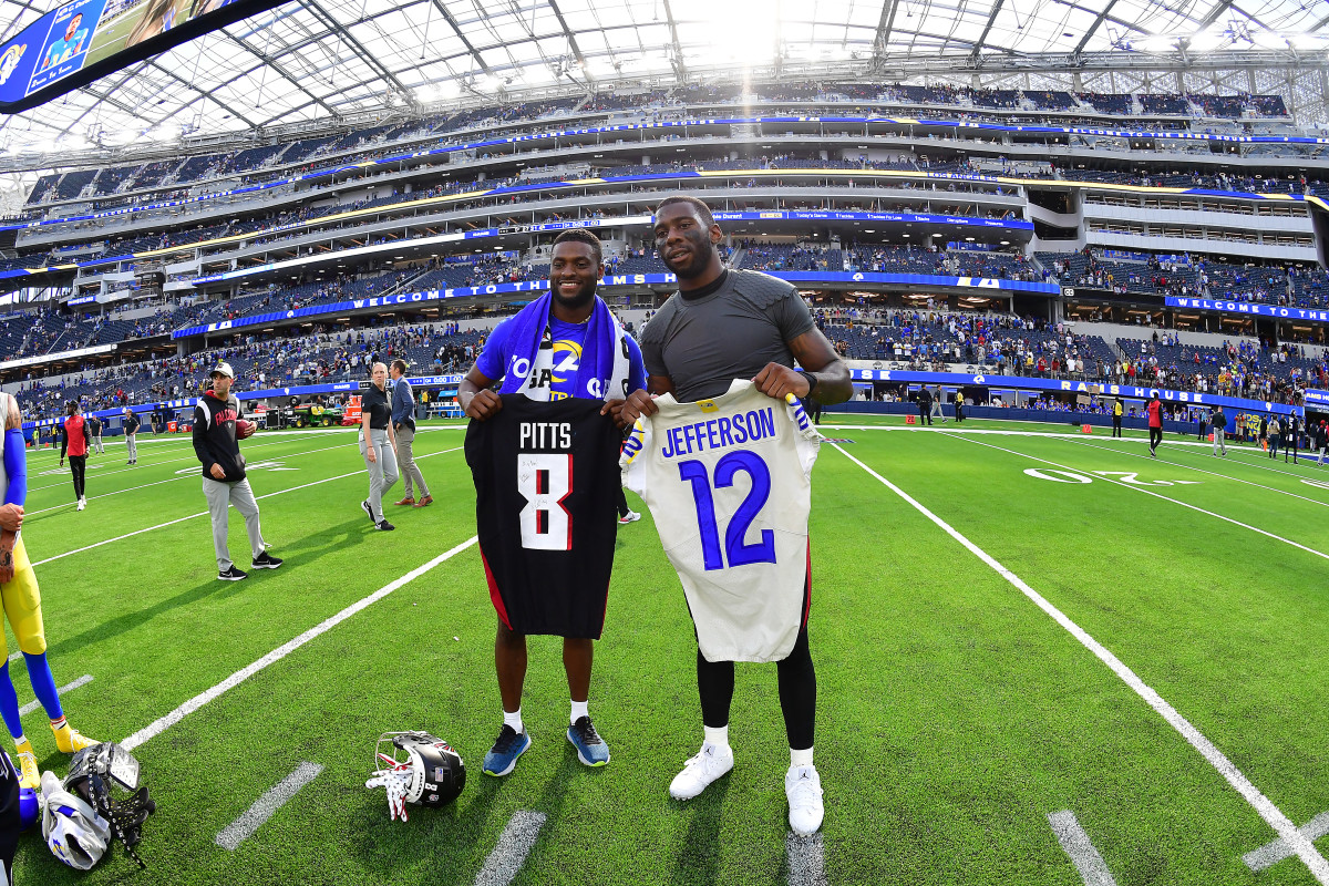 Los Angeles Rams wide receiver Van Jefferson (12) and Atlanta Falcons tight end Kyle Pitts (8) exchange jerseys following the game at SoFi Stadium.