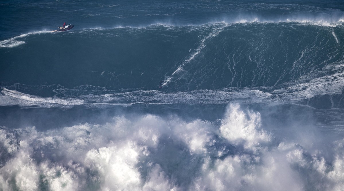 Tony Laureano riding a wave in Nazaré.