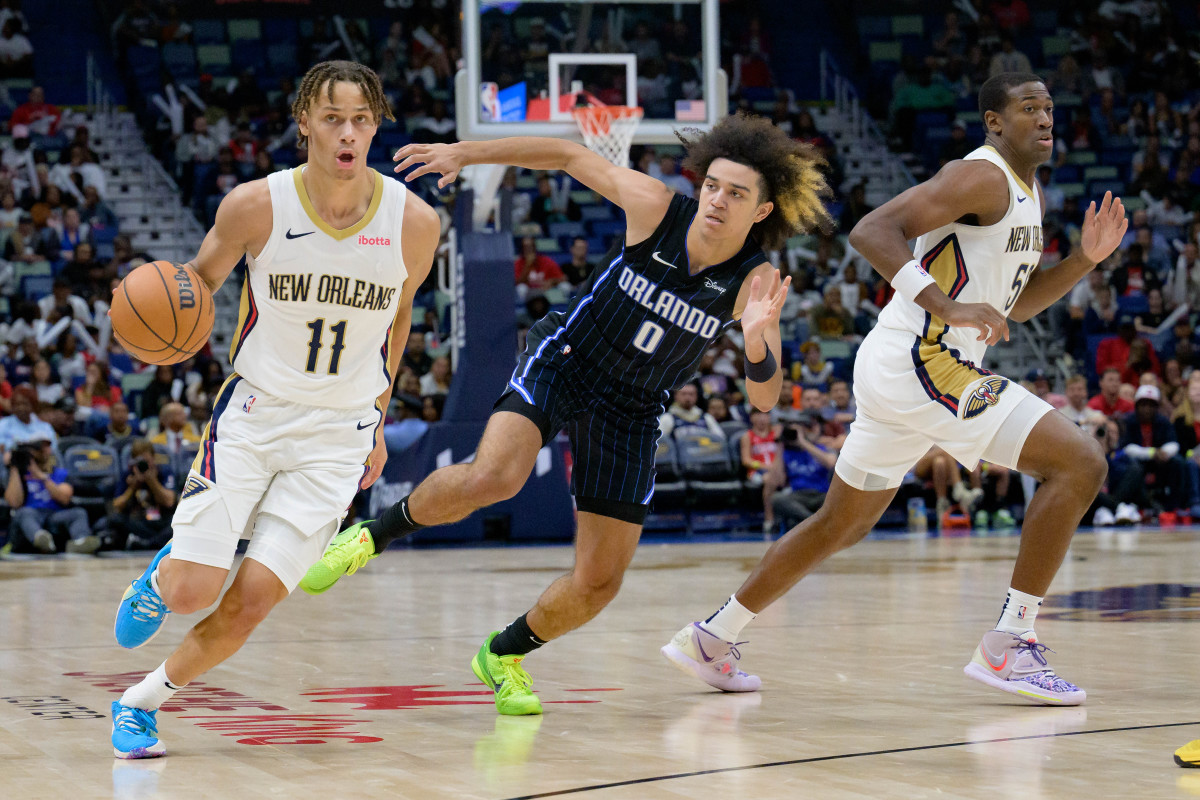 New Orleans Pelicans guard Dyson Daniels defended by Orlando Magic guard Anthony Black.