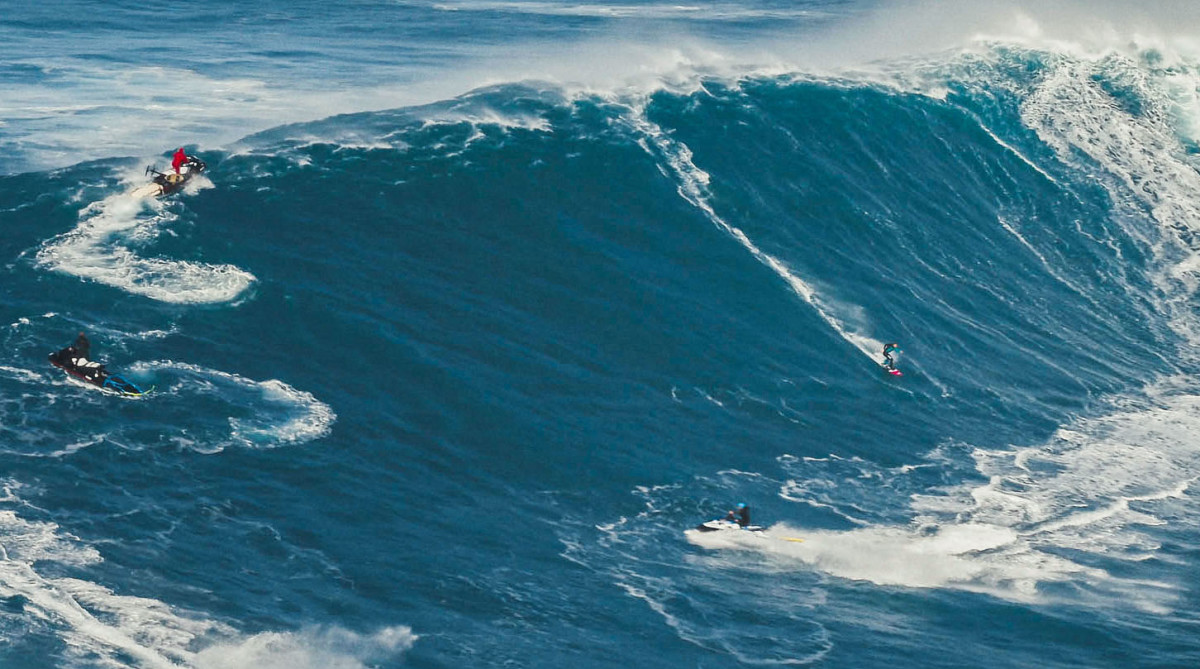 Surfers and jet skiers in Nazaré.