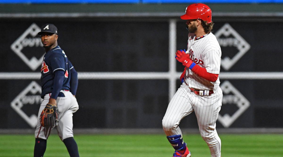 Phillies first baseman Bryce Harper (right) stares down Braves shortstop Orlando Arcia (not pictured) after hitting a solo home run during Game 3 of the NLDS.