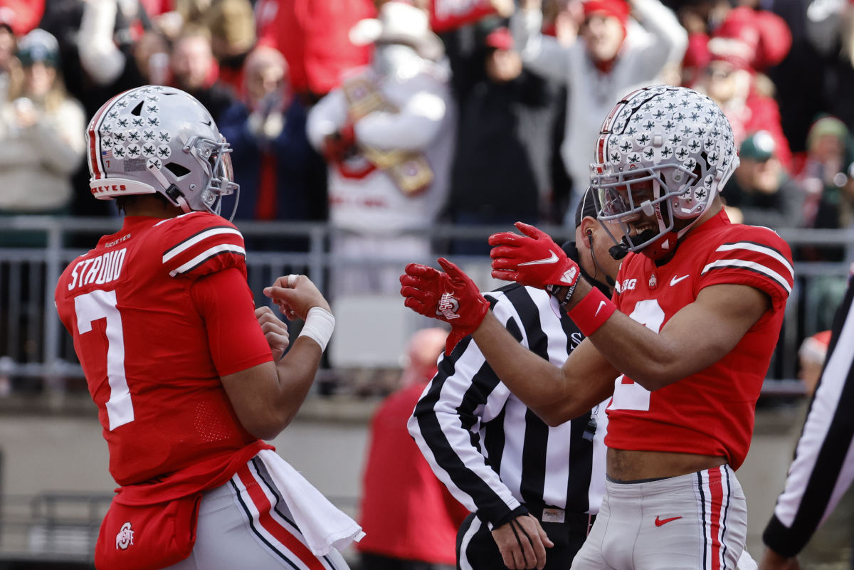 Nov 20, 2021; Columbus, Ohio, USA; Ohio State Buckeyes wide receiver Chris Olave (2) celebrates with Ohio State Buckeyes quarterback C.J. Stroud (7) after he scores a touchdown in the first half against the Michigan State Spartans at Ohio Stadium.