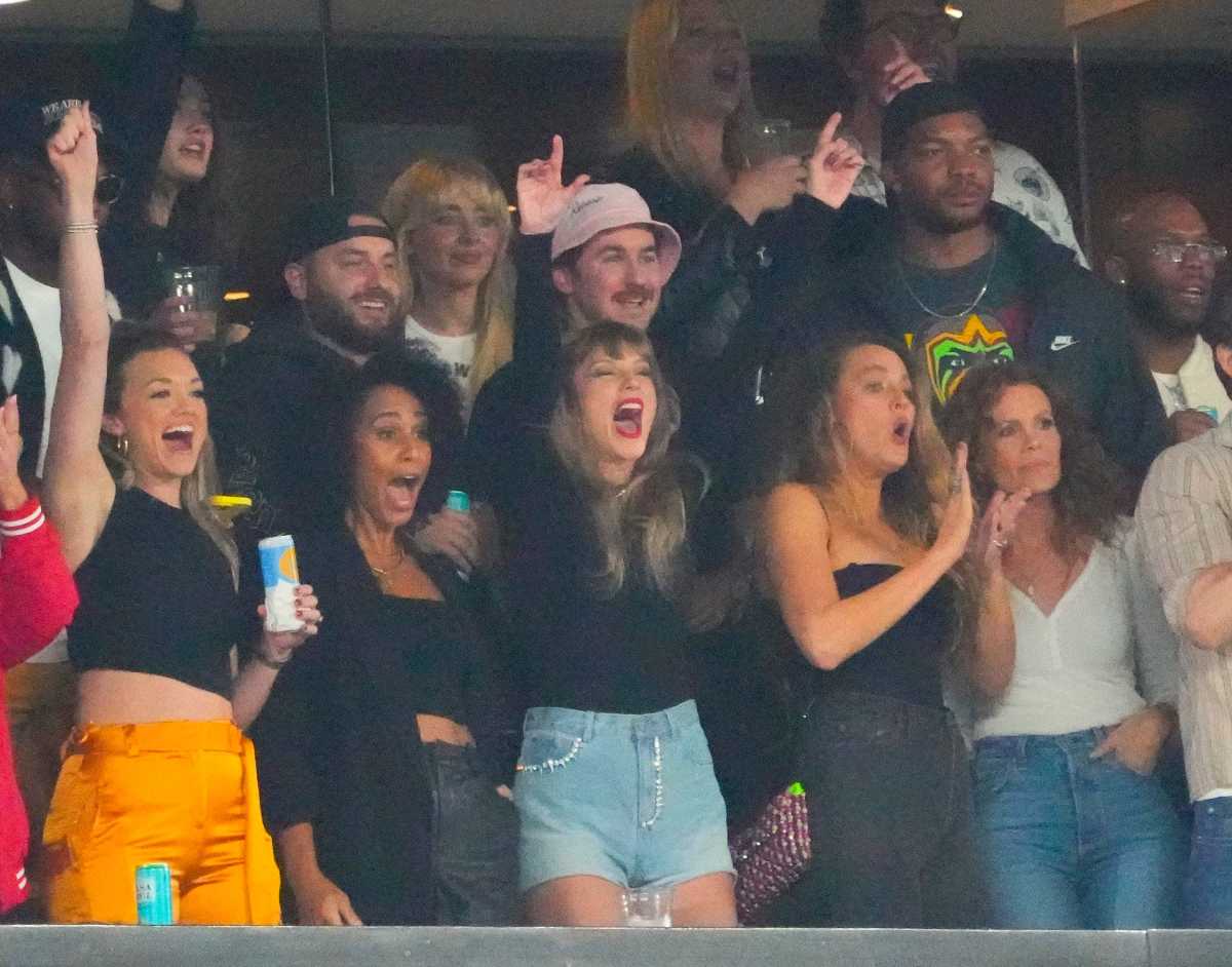 Taylor Swift, a guest of Kansas City Chiefs tight end Travis Kelce, cheers during the game at MetLife Stadium.