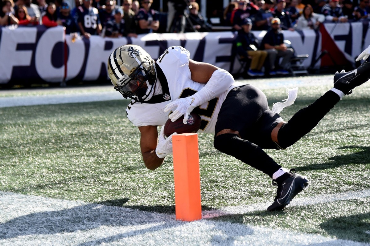 Oct 8, 2023; New Orleans Saints receiver Chris Olave (12) can t control the ball as he crosses the end zone against the New England Patriots. Mandatory Credit: Bob DeChiara-USA TODAY