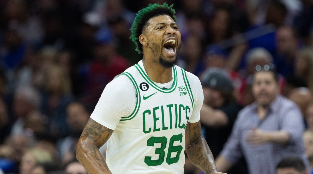 Former Celtics guard Marcus Smart yells after scoring during a game against the 76ers.