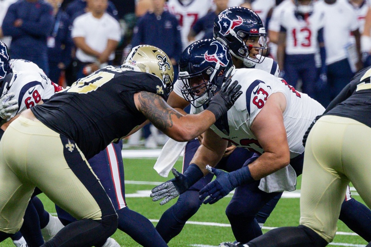 Aug 27, 2023; Houston Texans center Michael Deiter (63) takes on New Orleans Saints defensive tackle Bryan Bresee (90). Mandatory Credit: Stephen Lew-USA TODAY Sports