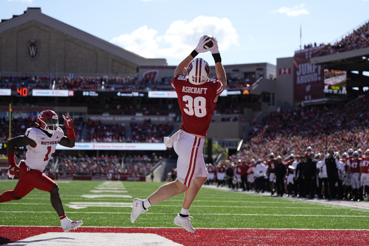 Oct 7, 2023; Madison, Wisconsin, USA; Wisconsin Badgers tight end Tucker Ashcraft (38) catches a pass to score a touchdown during the fourth quarter against the Rutgers Scarlet Knights at Camp Randall Stadium. Mandatory Credit: Jeff Hanisch-USA TODAY Sports