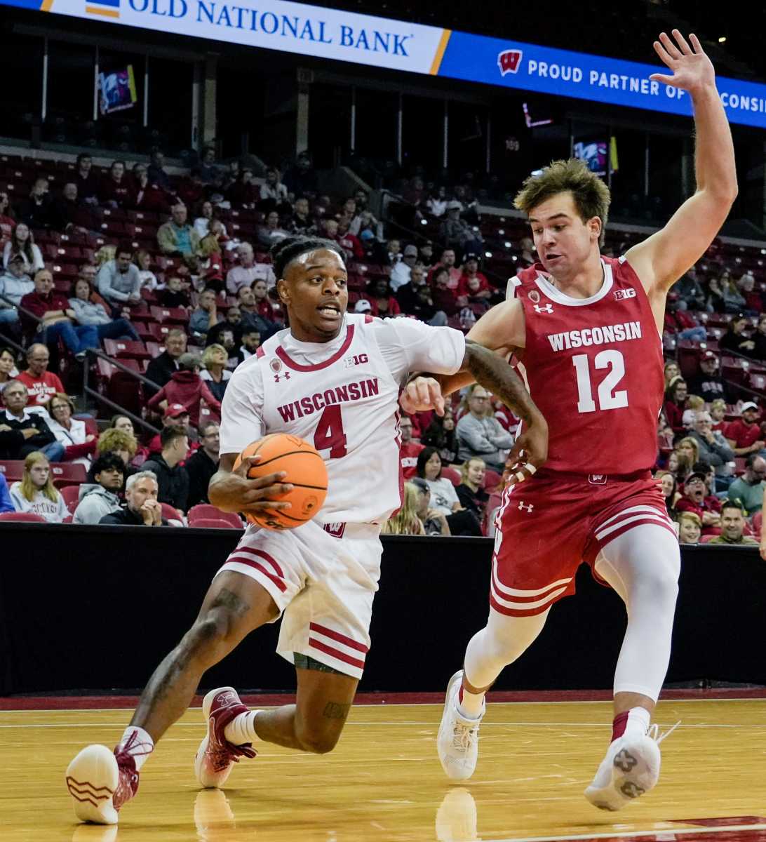 (Left) Wisconsin Badgers guard Kamari McGee (4) breaks through (right) guard Luke Heartle (12) defense during the second half of the Red & White scrimmage on Sunday October 09, 2022 at the Kohl Center in Madison, Wis. Mjs 221009 Uwmen10 P14 115157658