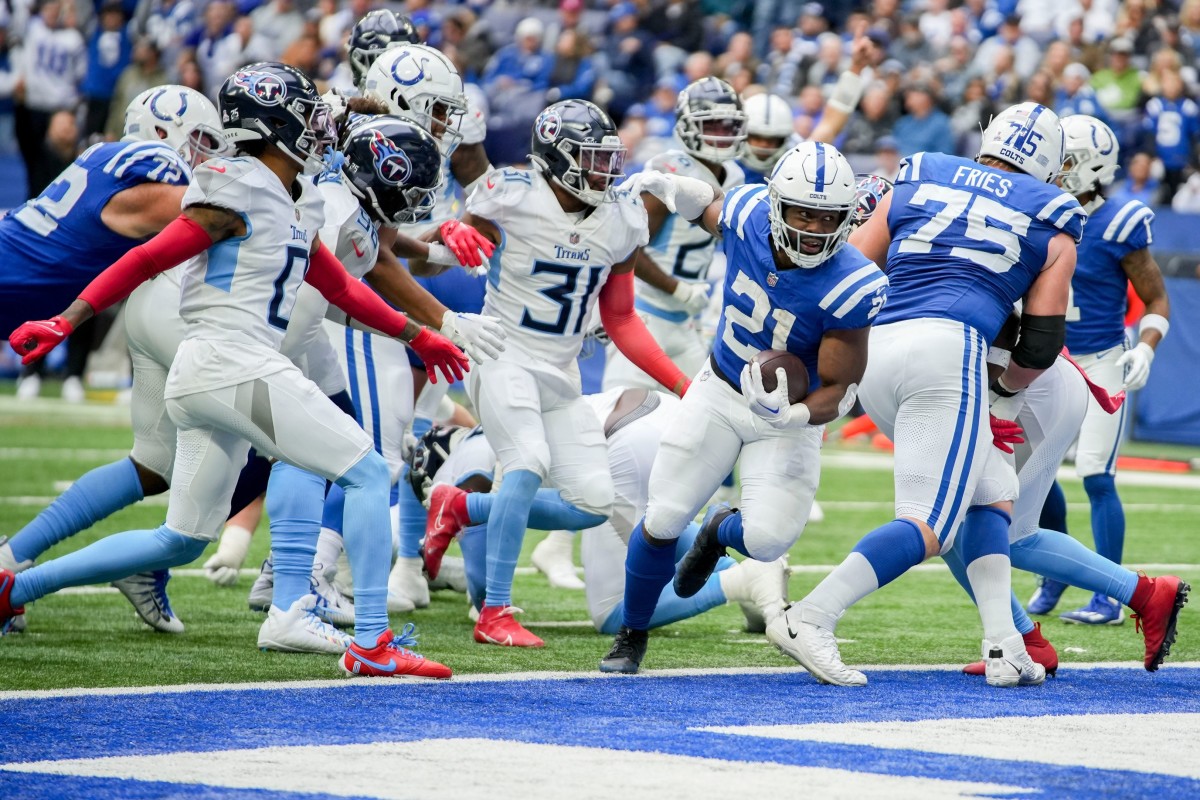 Indianapolis Colts running back Zack Moss (21) rushes into the end zone for a touchdown Sunday, Oct. 8, 2023, during a game against the Tennessee Titans at Lucas Oil Stadium in Indianapolis.