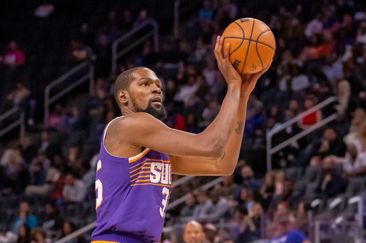 Phoenix Suns forward Kevin Durant (35) shoots a free throw against the Detroit Pistons during the first half of a pre-season game at Little Caesars Arena.