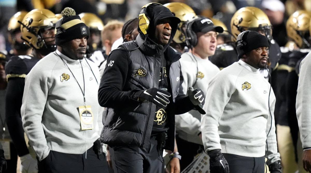 Colorado head coach Deion Sanders looks on from the sidelines during a game.