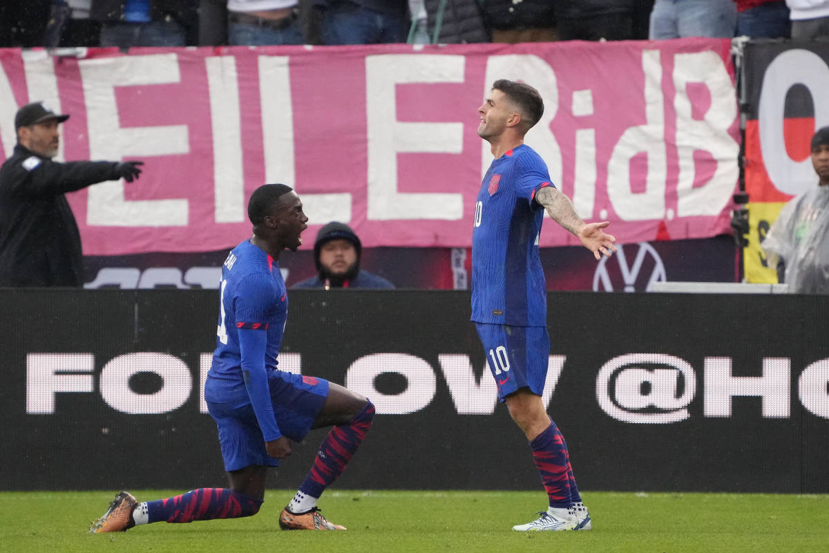 Christian Pulisic pictured (right) celebrating after scoring for the USA against Germany in an international friendly in October 2023