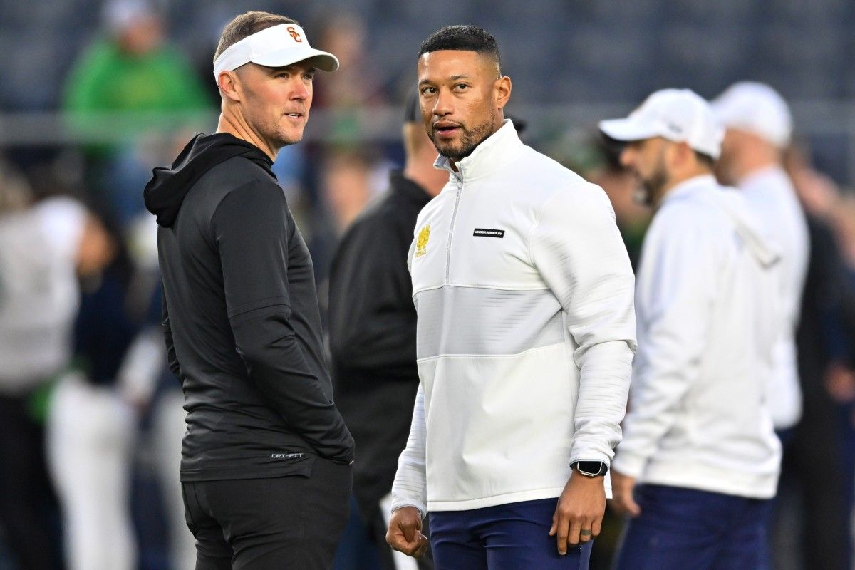 USC Head Coach Lincoln Riley (left) and Notre Dame Head Coach Marcus Freeman (right) ahead of the Trojans' 48-20 defeat at the hands of Notre Dame.