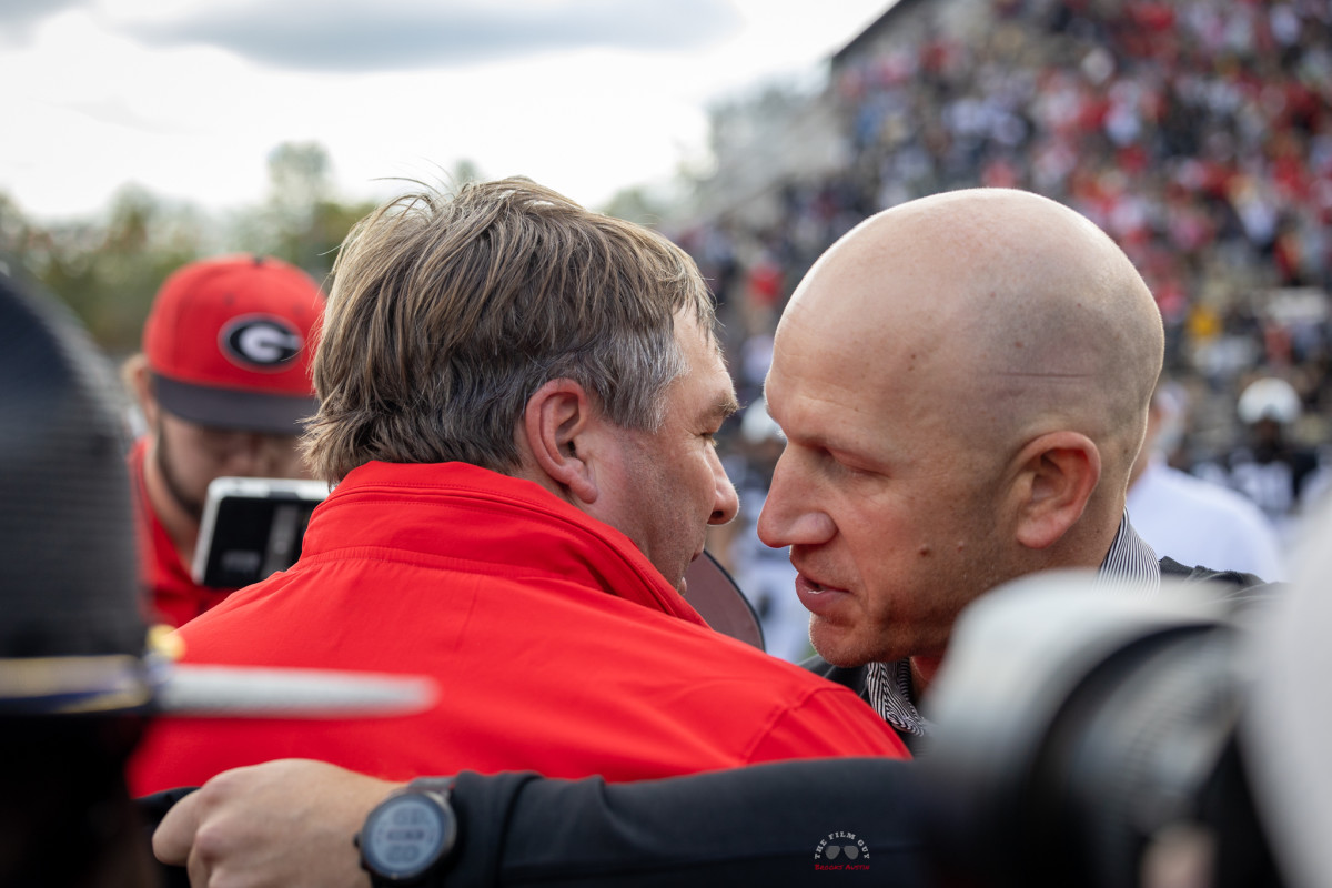 Vanderbilt Coach Clark Lea and Kirby Smart meet following their matchup. / Photo - Brooks Austin 