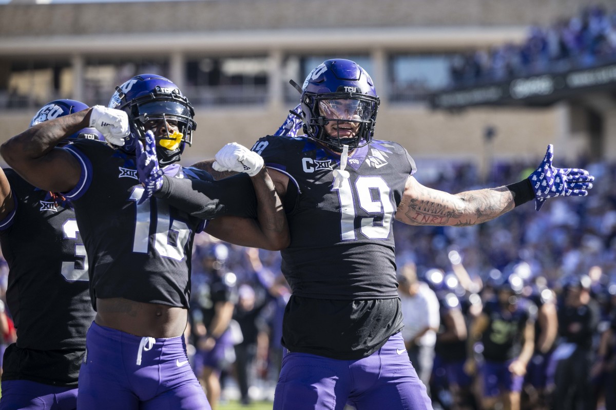 Oct 14, 2023; Fort Worth, Texas, USA; TCU Horned Frogs tight end Jared Wiley (19) and wide receiver Dylan Wright (16) celebrate after Wiley scores a touchdown against the Brigham Young Cougars during the game at Amon G. Carter Stadium. Mandatory Credit: Jerome Miron-USA TODAY Sports