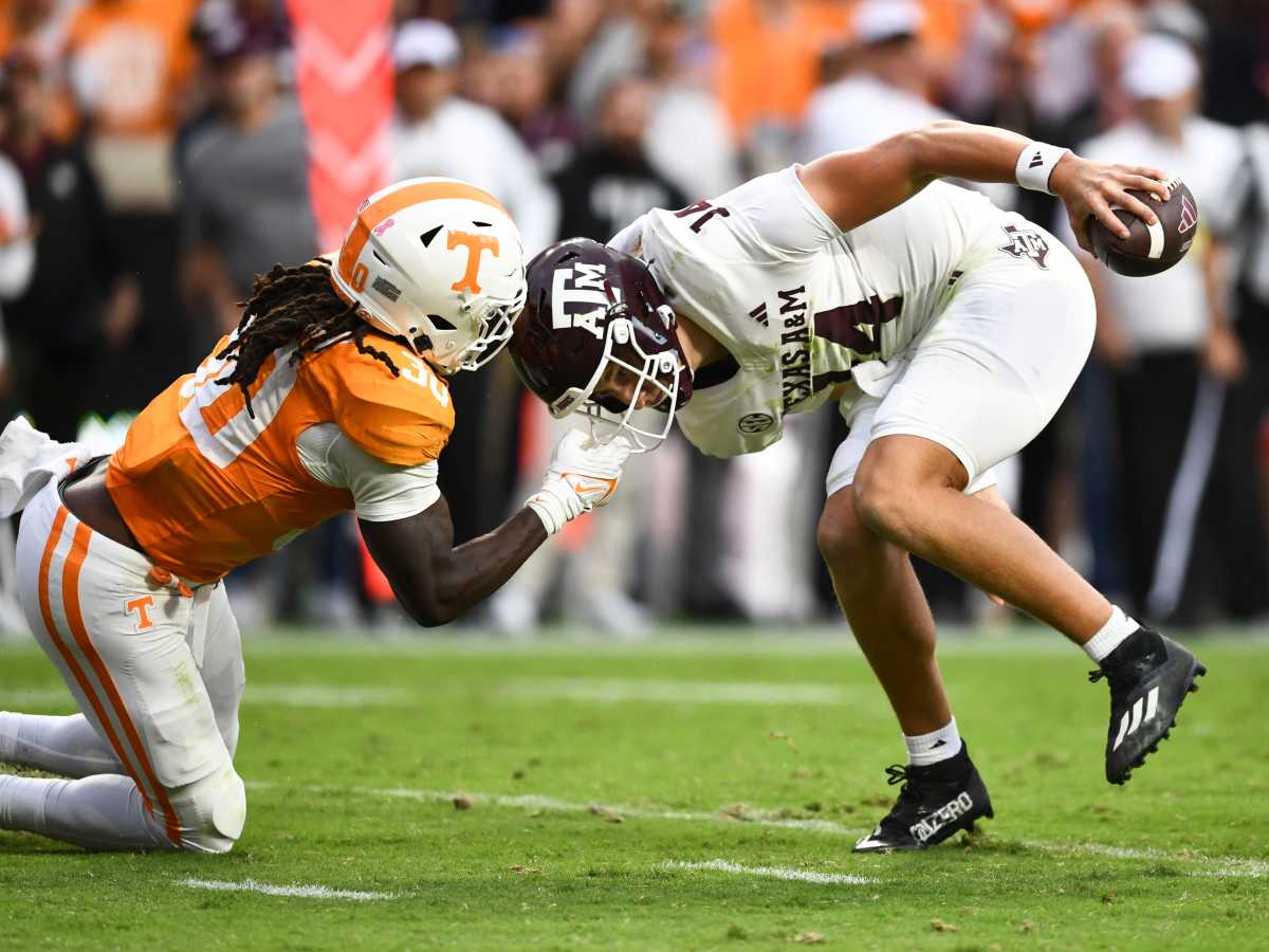 Tennessee defensive lineman Roman Harrison (30) face masks Texas A&M quarterback Max Johnson (14) during an NCAA college football game on Saturday, October 14, 2023 in Knoxville, Tenn.