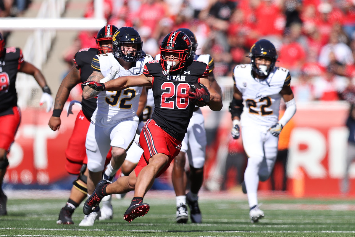 Oct 14, 2023; Salt Lake City, Utah, USA; Utah Utes safety Sione Vaki (28) runs the ball against the California Golden Bears in the first quarter at Rice-Eccles Stadium. Mandatory Credit: Rob Gray-USA TODAY Sports